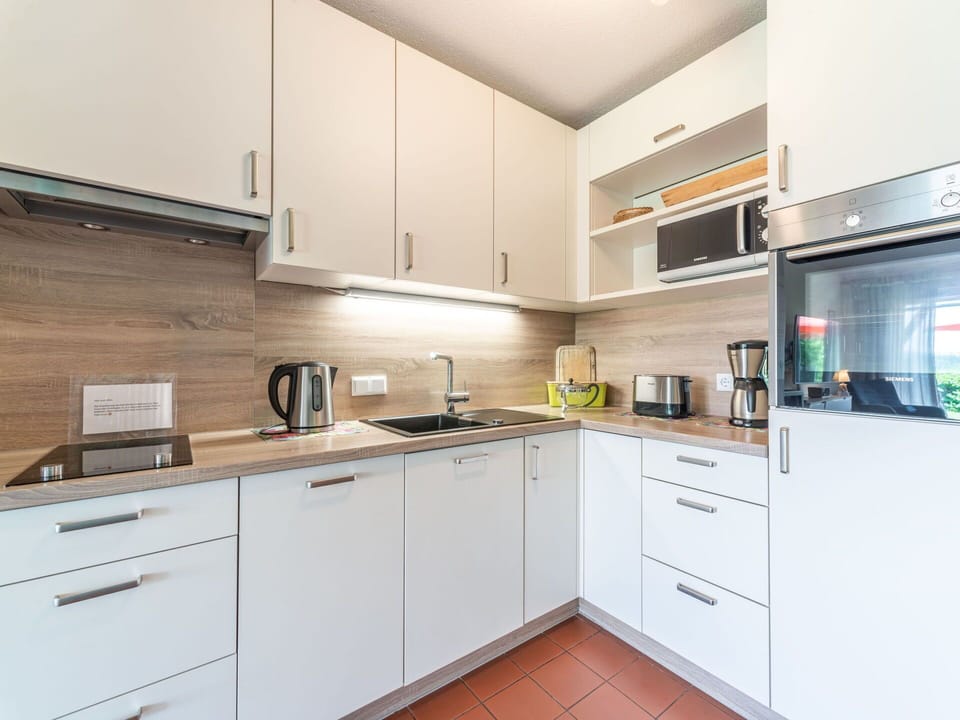 Cabinetry, Countertop, Property, Building, Kitchen Stove, Kitchen, Drawer, Kitchen Appliance, Wood, Sink