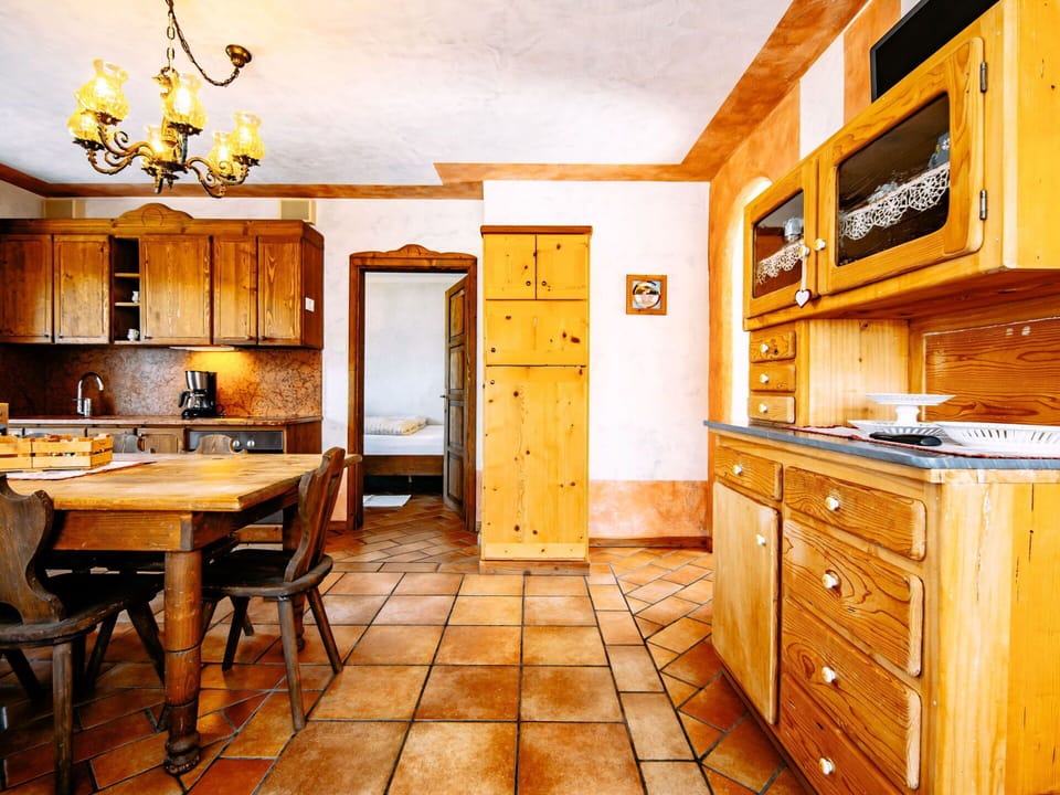 Furniture, Cabinetry, Property, Table, Wood, Interior Design, Lighting, Kitchen, Countertop, Door