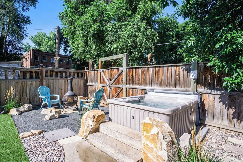 Backyard | Hot Tub, Shaded Lounge Area and Chiminea