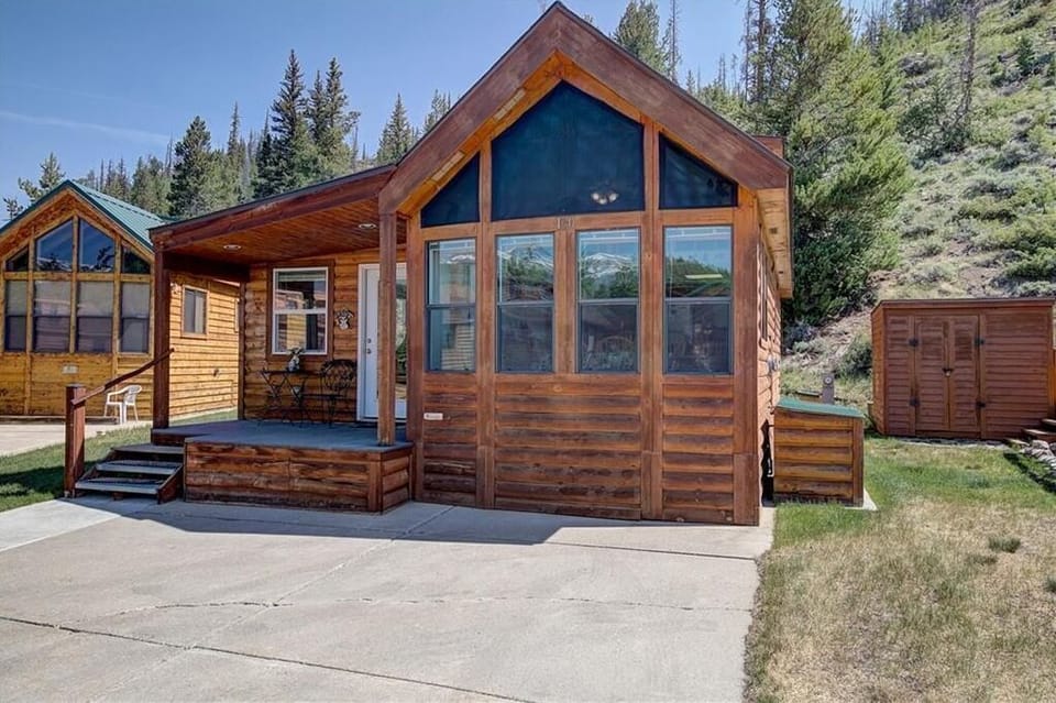 The covered deck offers a peaceful spot to enjoy your morning coffee while soaking in fresh alpine air and mountain views.