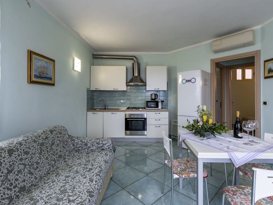 Furniture, Cabinetry, Picture Frame, Living Room, Countertop, Wood, Houseplant, Home Appliance, Flooring