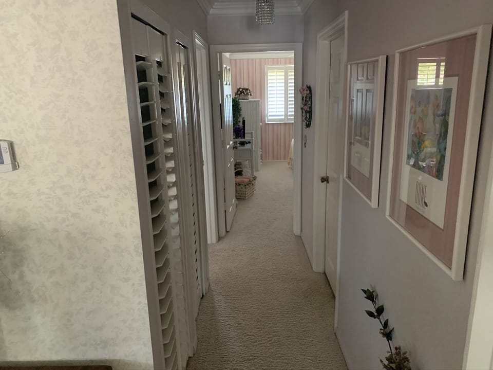 hallway to Guest BR. Guest bath to right, den and linen closet to left