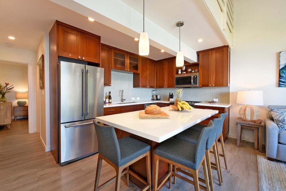 Fully equipped kitchen featuring rich wood cabinetry and sleek countertops