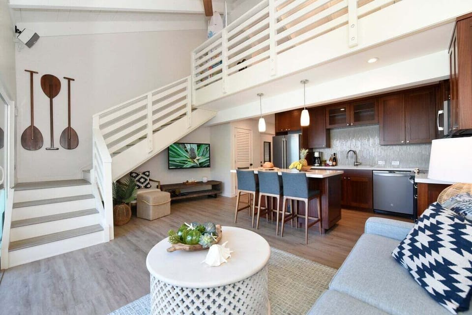 Bright and airy design featuring a staircase and chic coastal accents