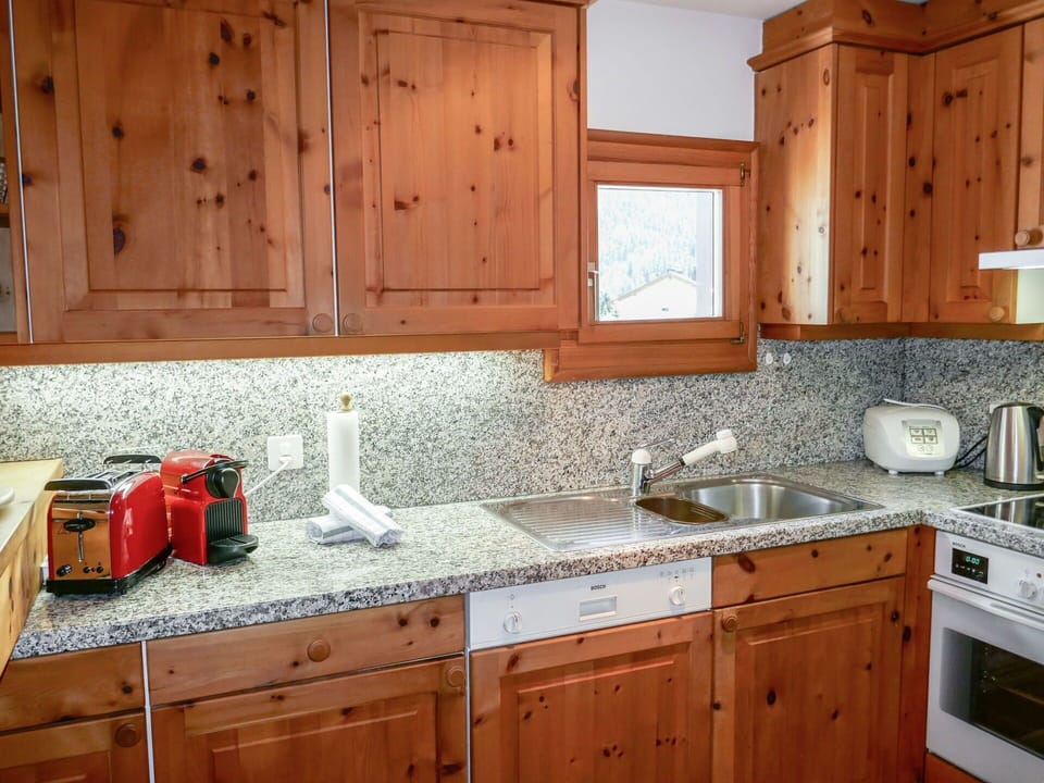 Countertop, Cabinetry, Kitchen, Room, Furniture, Property, Sink, Wood Stain, Tile, Interior Design