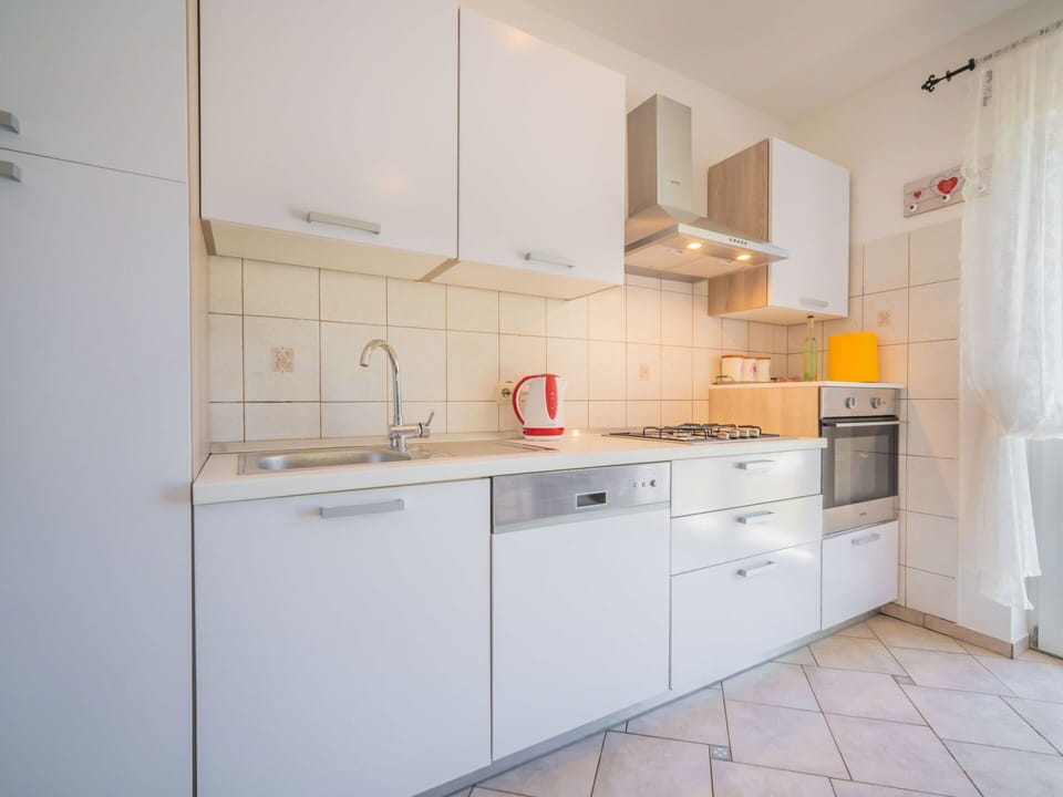 Property, Room, Furniture, Kitchen, Cabinetry, Interior Design, Building, House, Tile, Floor