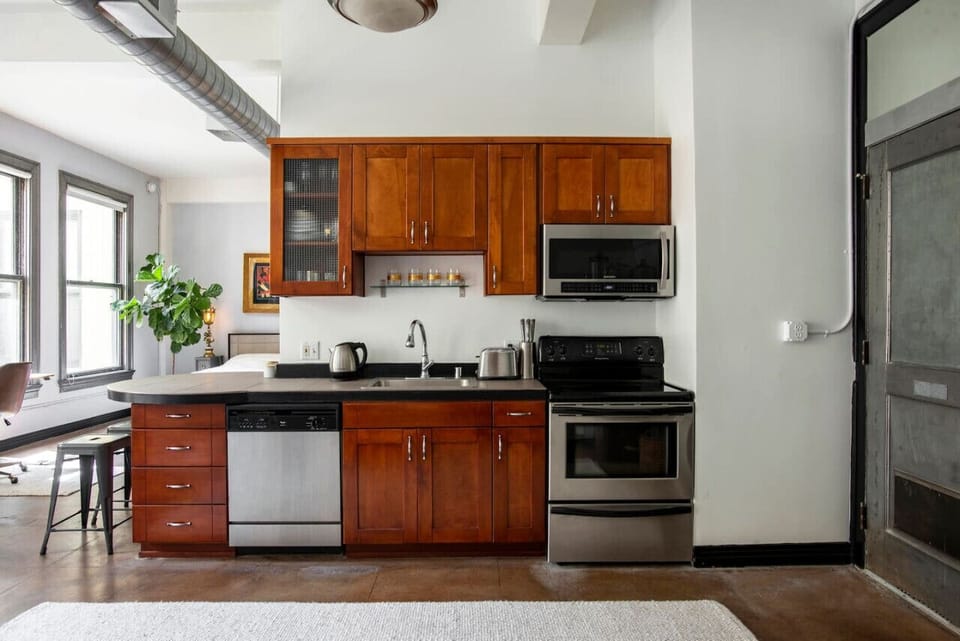 Fully Stocked Kitchen with Modern Appliances and Ample Storage