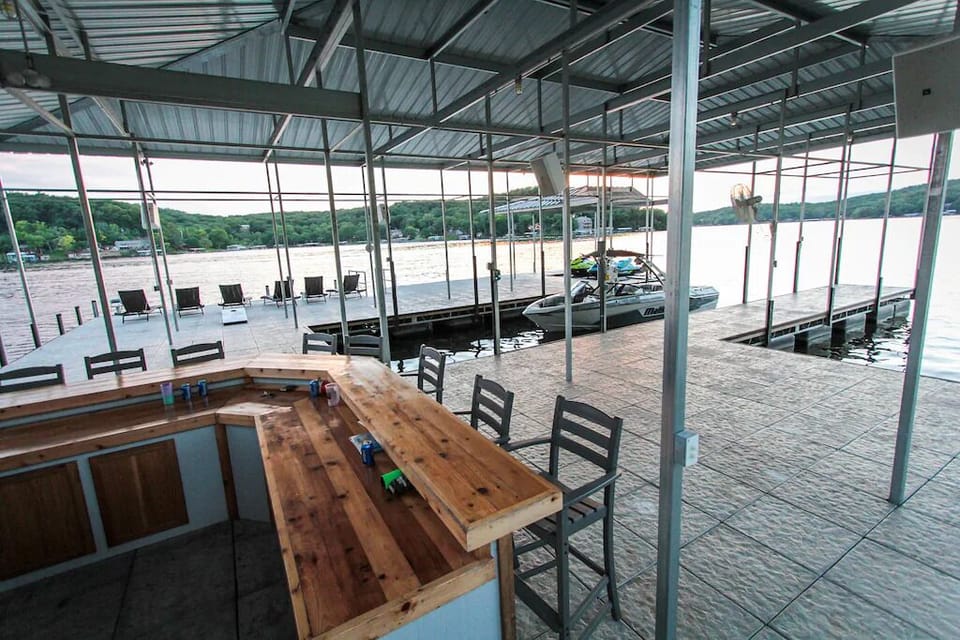 This commercial dock is a day event.  Complete with 2 huge slips, bar, television, custom built couch and speaker system.  You will spend all day down here.