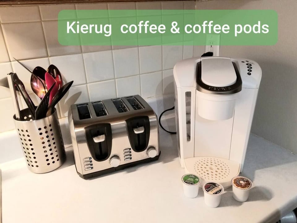 Keurig coffee maker & coffee pods. Toaster and kitchen utensils. 
