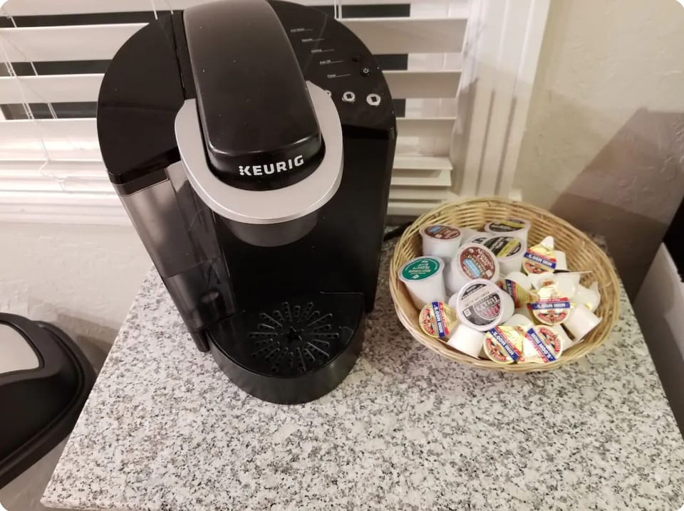 Keurig coffee maker and various coffee pods to get your morning going!