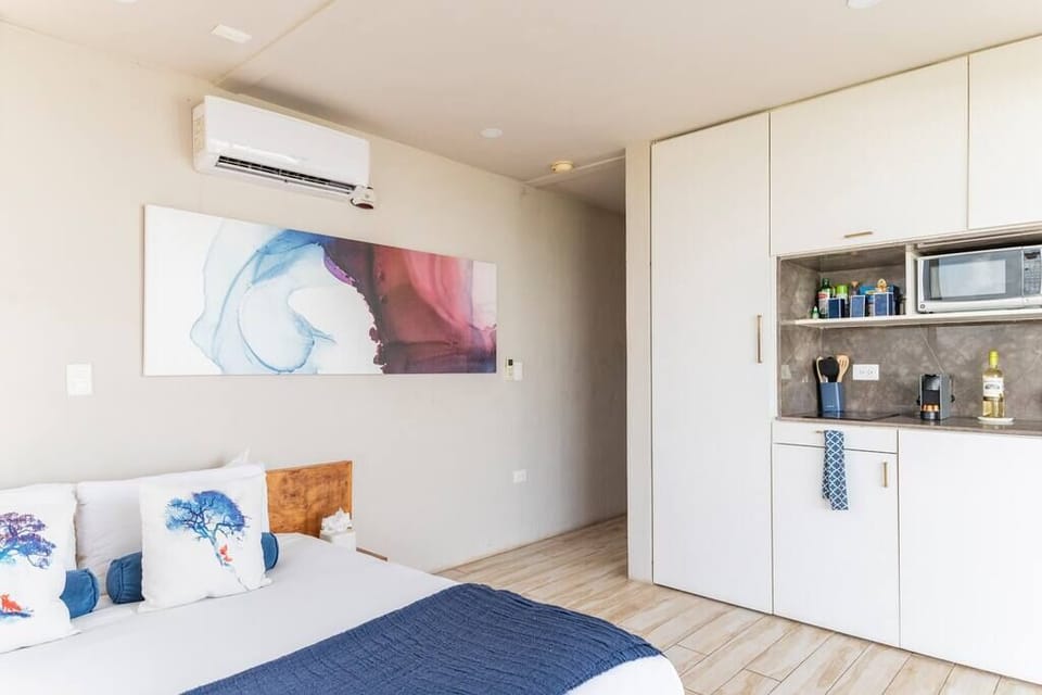 King-sized bed with custom casework, incredible jungle views, and blackout shades. (3)