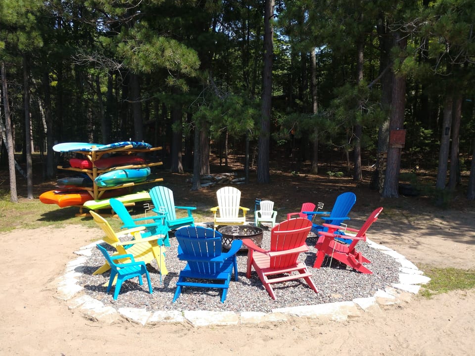 lakeside firepit, complimentary firewood and various kayaks and paddle boards