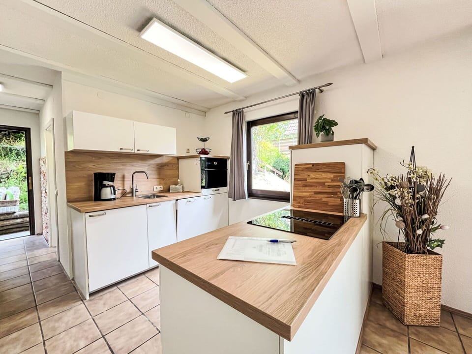 Furniture, Countertop, Kitchen, Flooring, Interior Design, Wood, Floor, Cabinetry, Major Appliance, Kitchen Appliance