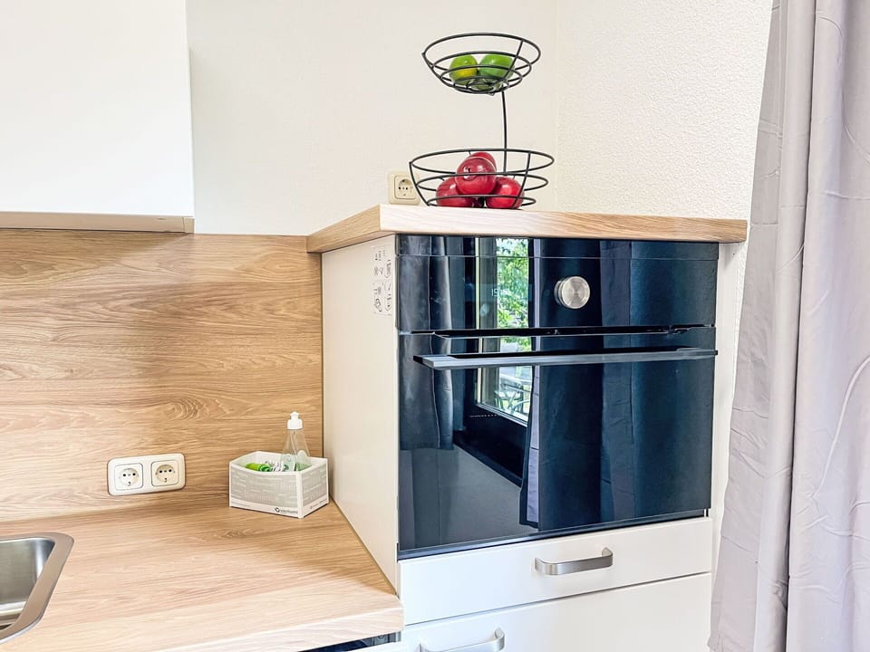 Kitchen Appliance, Kitchen, Cabinetry, Countertop, Home Appliance, Flooring, Major Appliance, Wood, Interior Design, Furniture