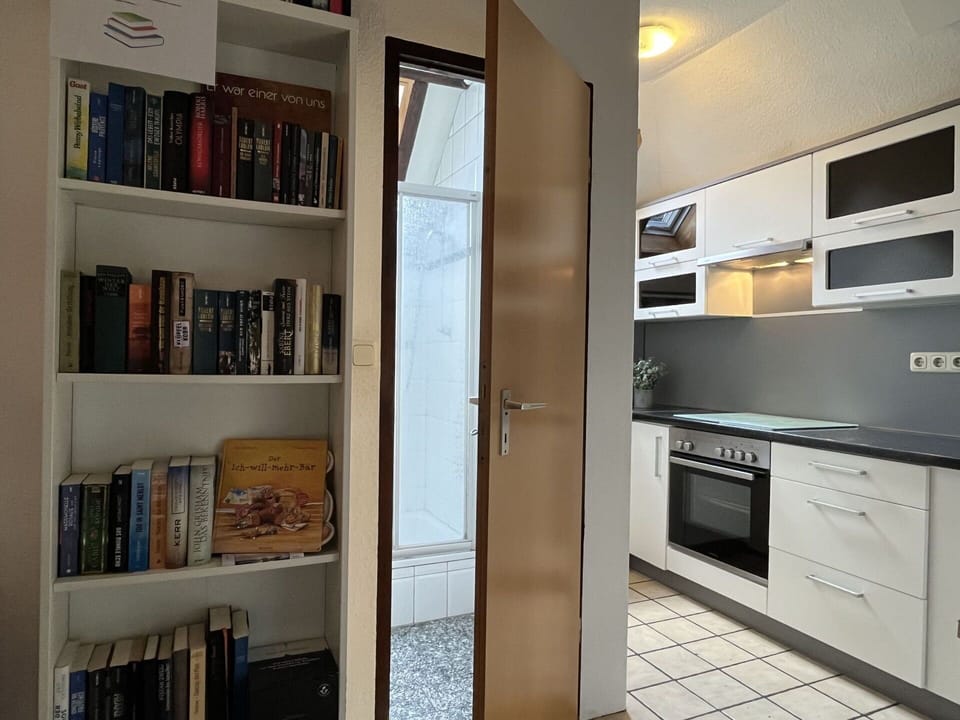 Cabinetry, Furniture, Bookcase, Shelf, Countertop, Building, Wood, Kitchen Stove, Shelving, Interior Design