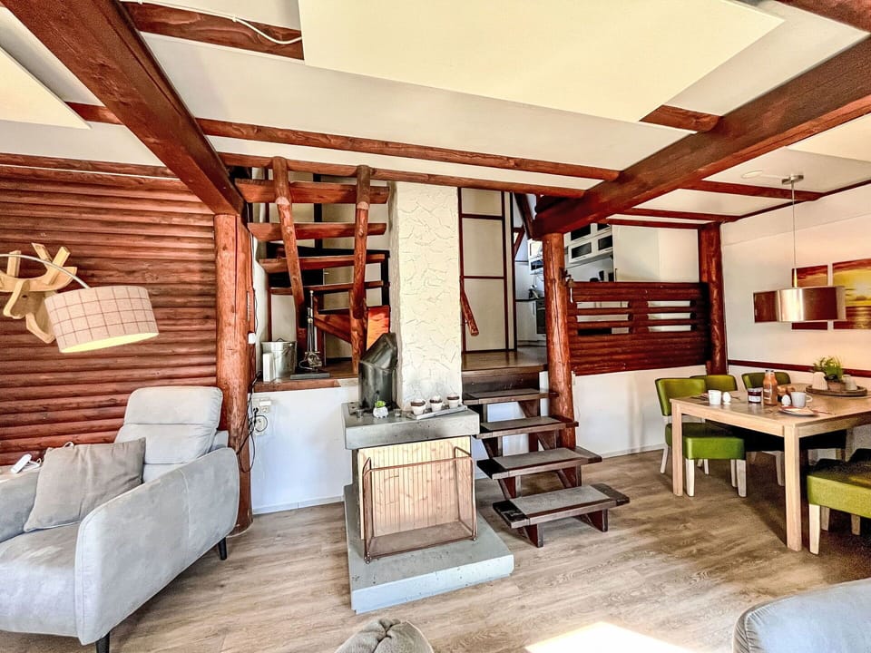 Furniture, Wood, Interior Design, Flooring, Floor, Ceiling, Living Room, Room, Couch, Hardwood