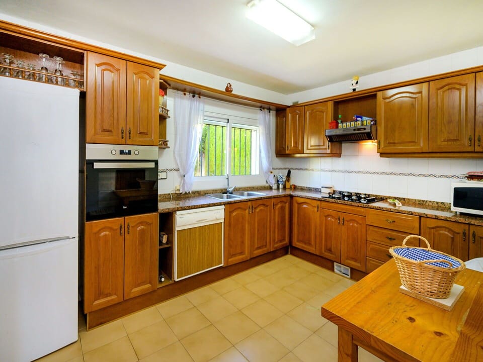 Furniture, Kitchen, Cabinetry, Wood, Interior Design, Major Appliance, Flooring, Kitchen Appliance, Countertop, Ceiling