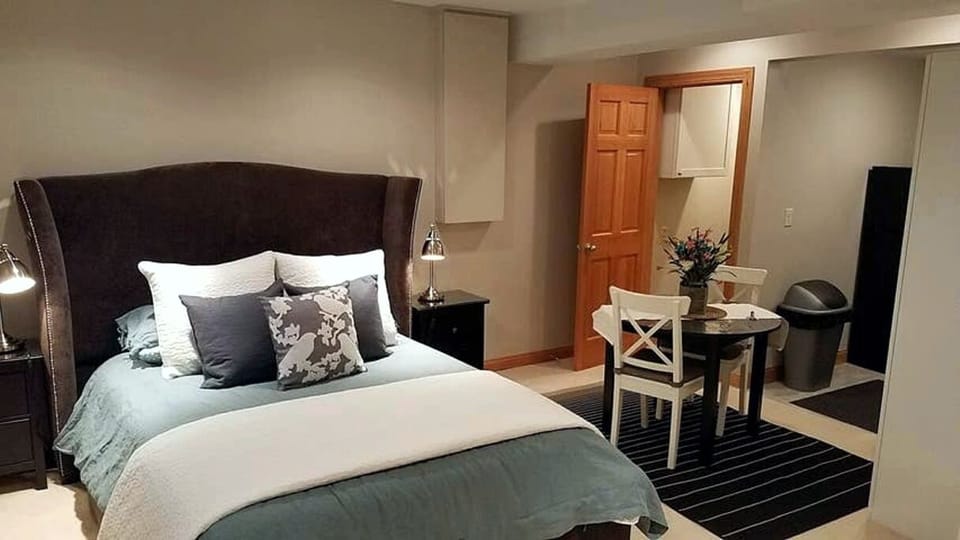 Dining table beside bed.