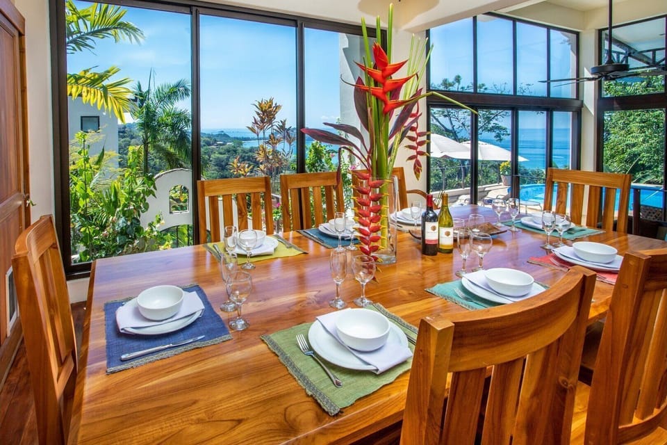 The 8-seat dining table affords an ocean view at mealtimes 