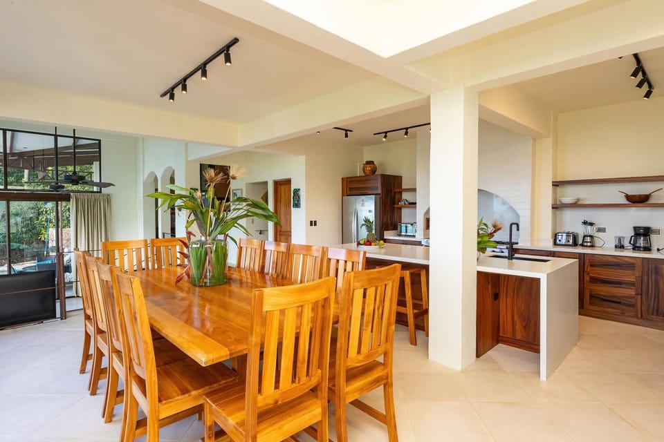 Warm open kitchen and dining area designed for relaxed meals together.