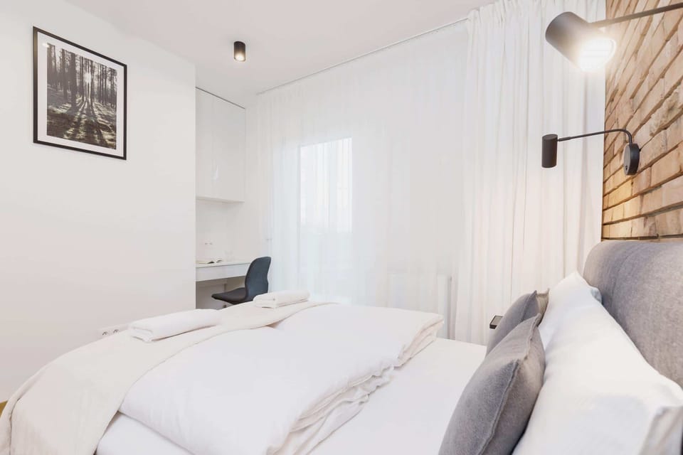The bedroom's desk and chair create a perfect workspace for business trips.