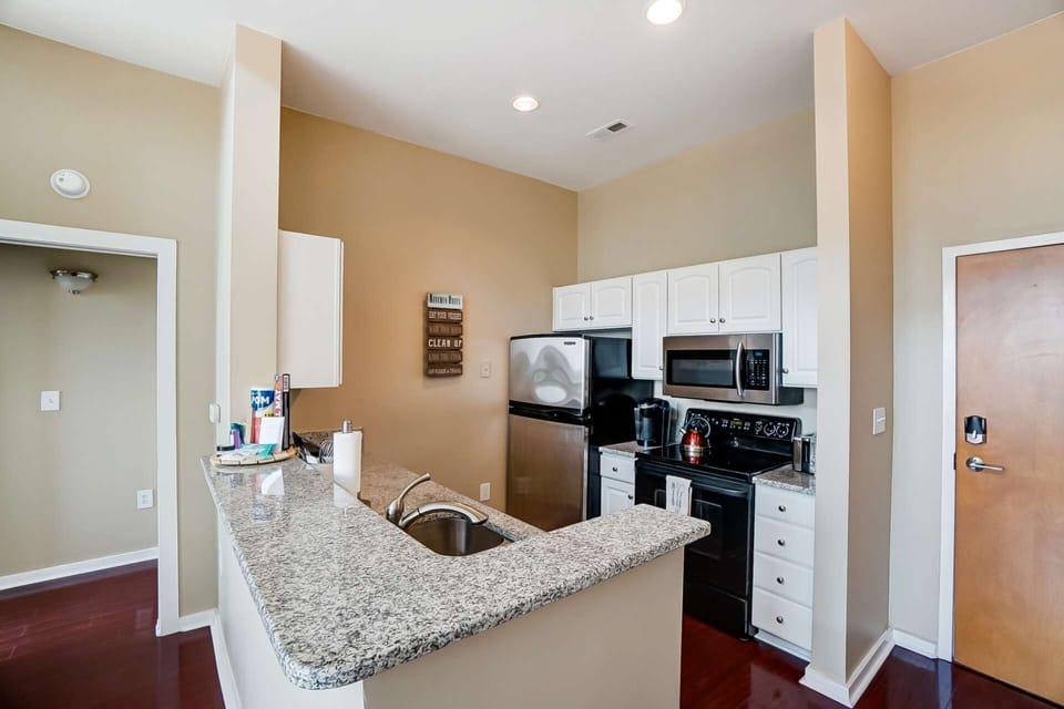 Updated kitchen features granite counter-tops with stainless steel appliances. Plenty of room to cook and enjoy your meals together.