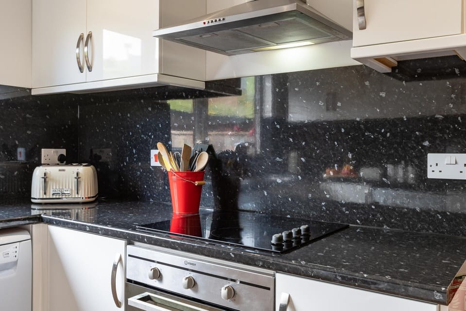 Well equipped kitchen with full size oven and easy clean hob