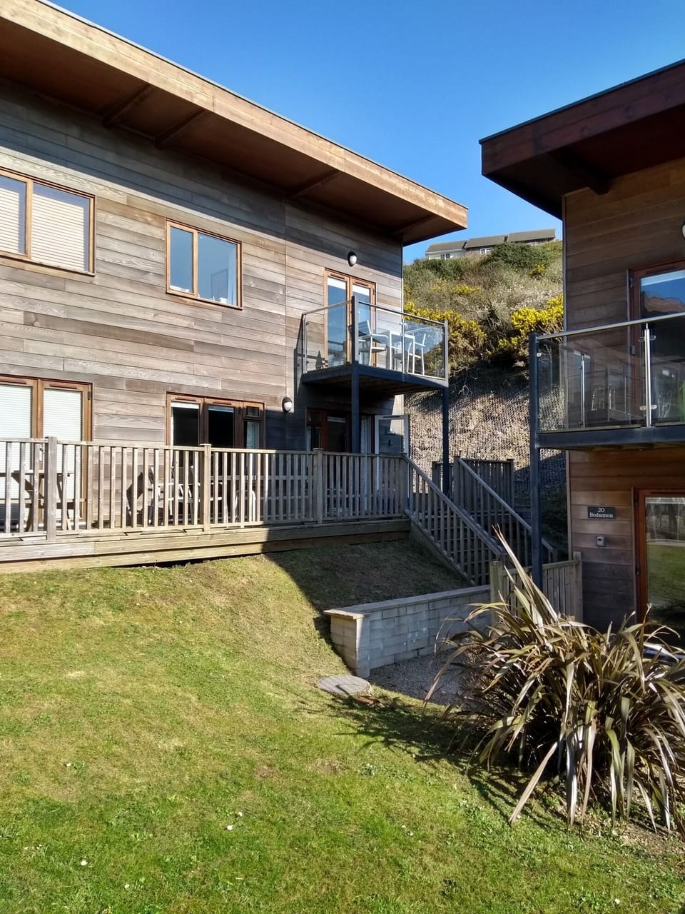 Timber clad eco-home. Front deck extended for 2026 season.