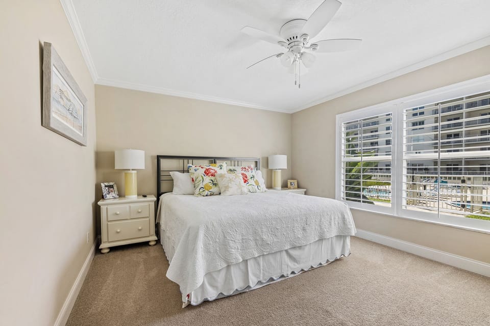 Spacious primary bedroom with a king-sized bed.