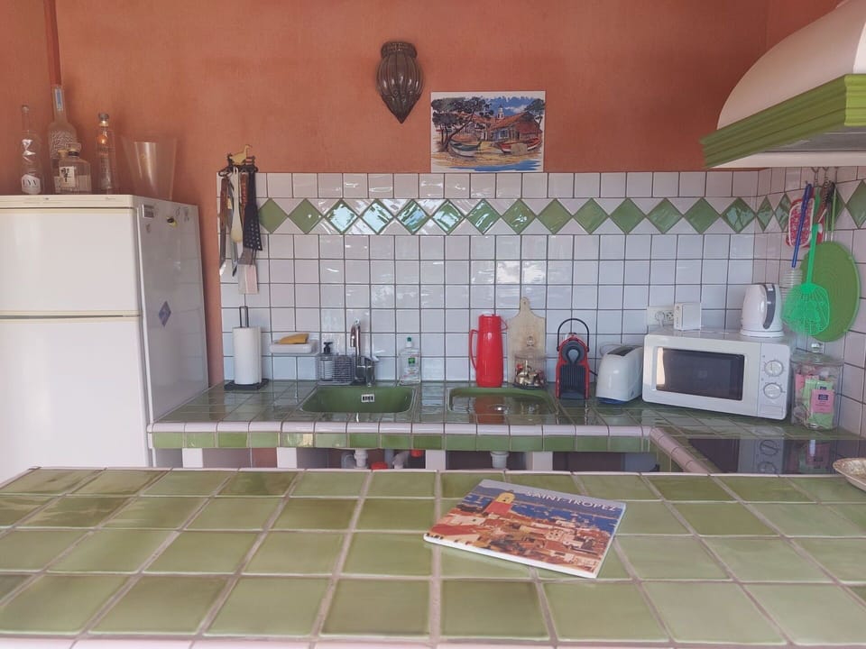 Flooring, Kitchen, Interior Design, Floor, Kitchen Appliance, Tile, Countertop, Furniture, Room, Home Appliance