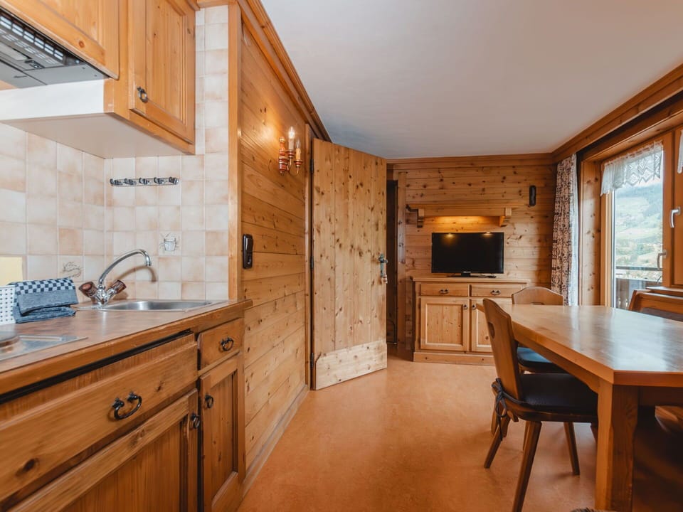 Table, Furniture, Cabinetry, Countertop, Sink, Kitchen, Wood, Lighting, Interior Design, Chair