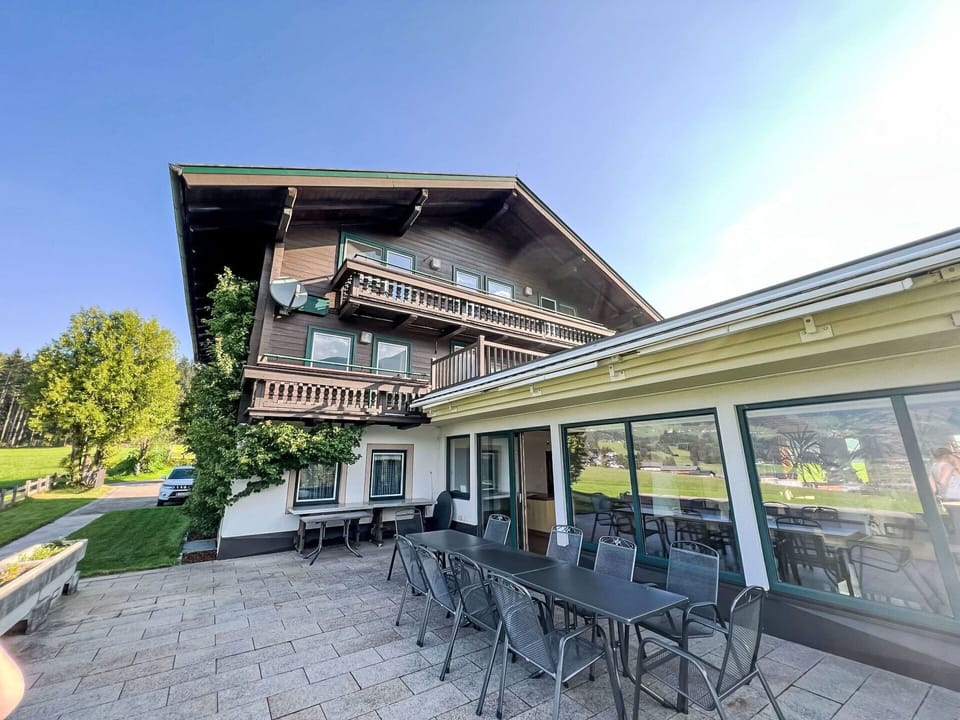 Sky, Building, Plant, Shade, Table, Chair, Outdoor Furniture, Urban Design, Leisure, Residential Area