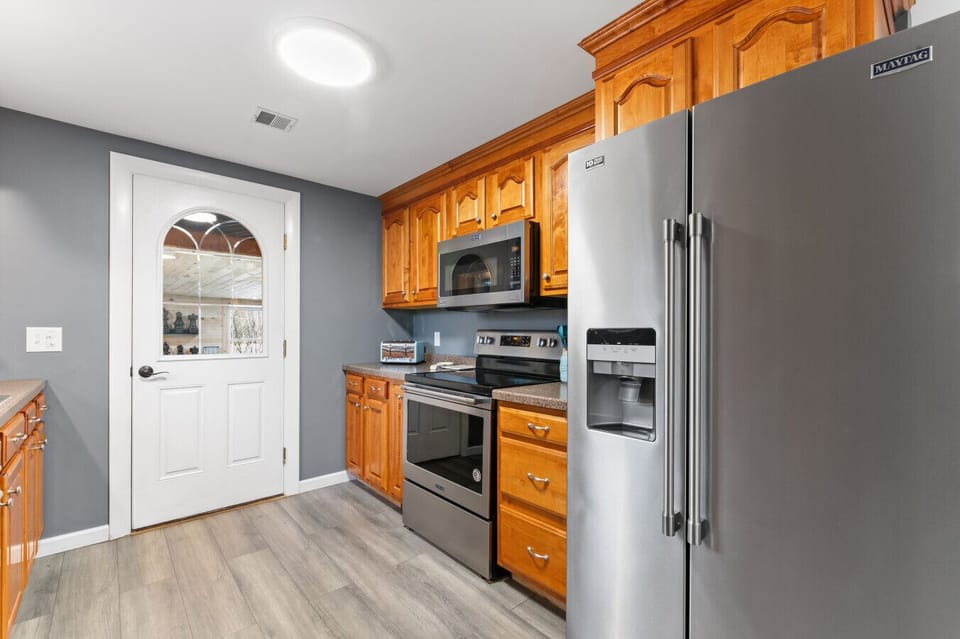 Modern kitchen with appliances, ready for your cooking needs.