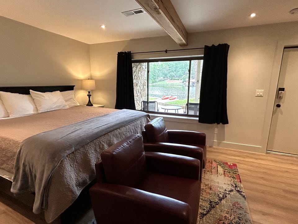 View from downstairs bedroom and door out to patio with bistro set