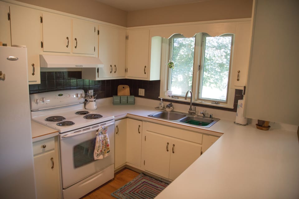 Kitchen is stocked with the essentials - dishwear, utensils, pots & pans, etc..