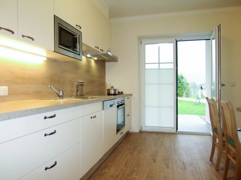 Property, Room, Furniture, Kitchen, Floor, Countertop, Building, Cabinetry, House, Yellow
