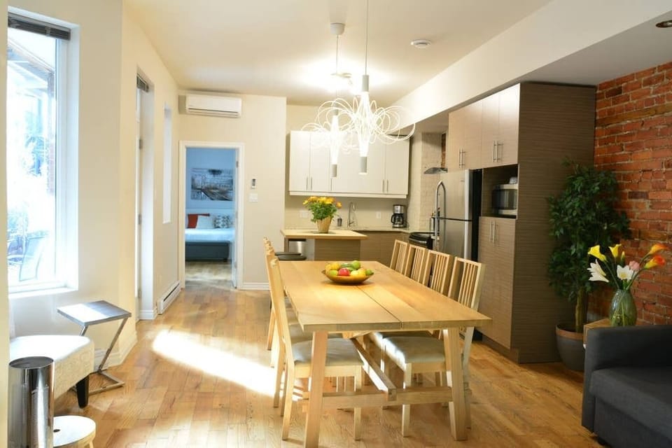 Dining table sits 10 people. Kitchen island sits 2 more.