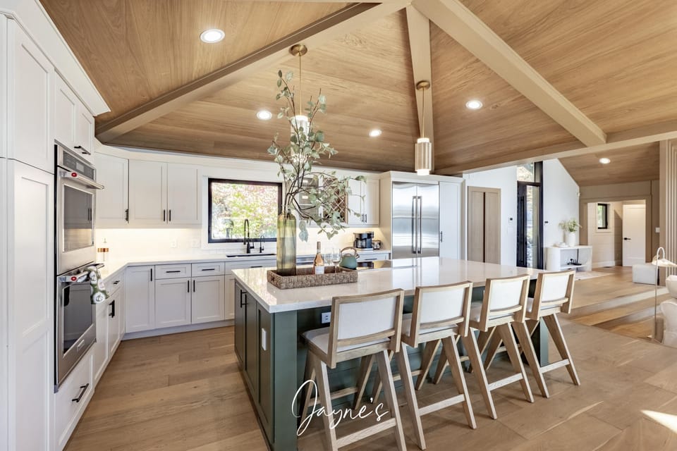 Spacious kitchen with vaulted ceilings and cozy island seating