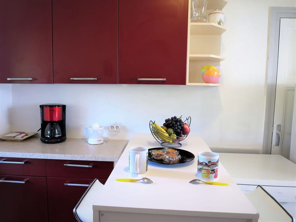 Cabinetry, Countertop, Property, Kitchen, Kitchen Appliance, Table, Tableware, Home Appliance, Interior Design, Yellow