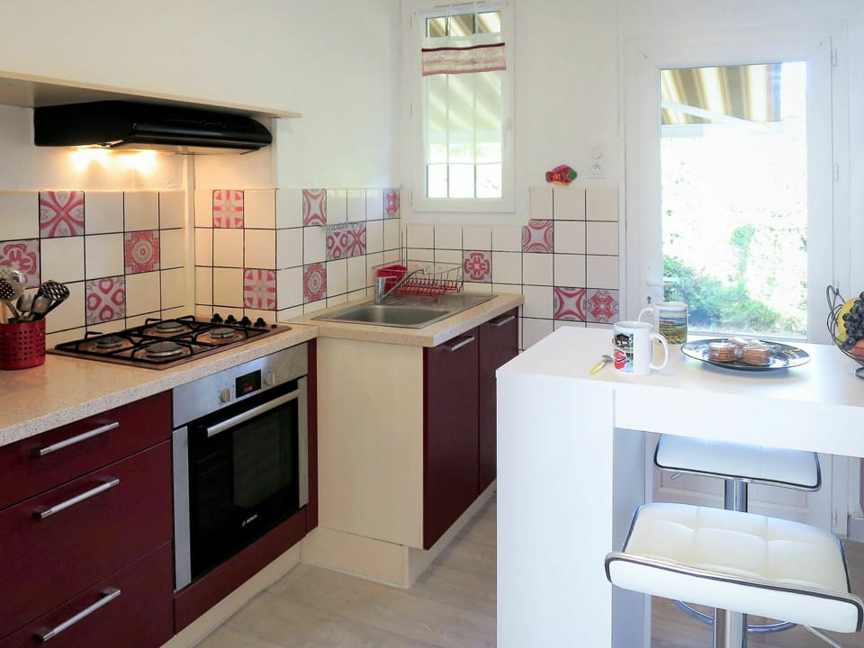 Room, Countertop, Kitchen, Property, Furniture, Cabinetry, Interior Design, Kitchen Stove, Building, Floor