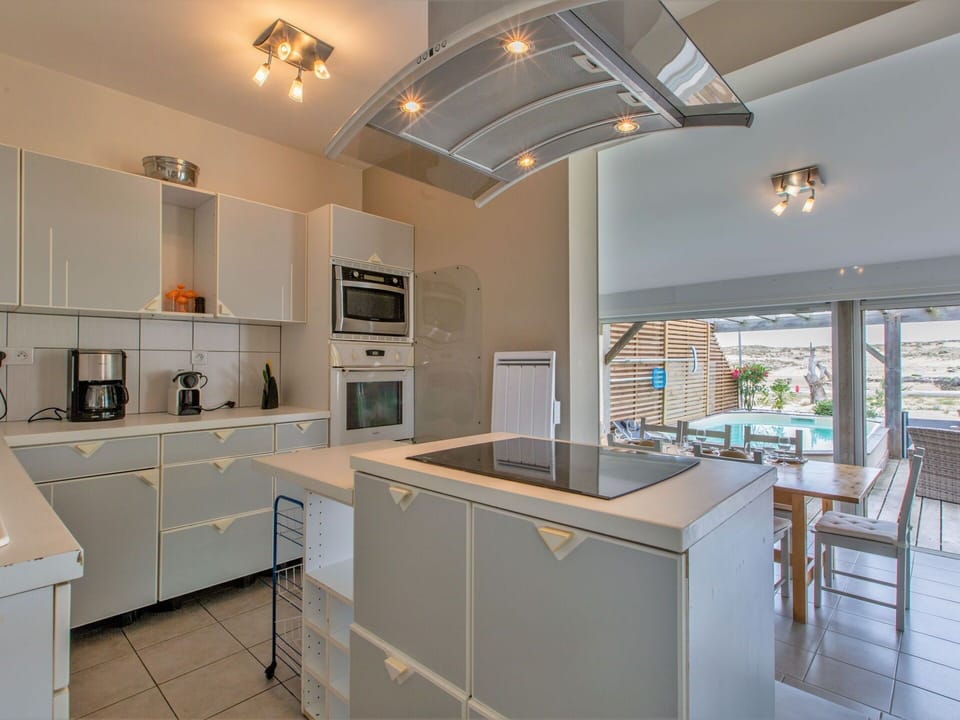 Cabinetry, Property, Countertop, Furniture, Kitchen Stove, Kitchen Appliance, Chair, Wood, Sink, Interior Design