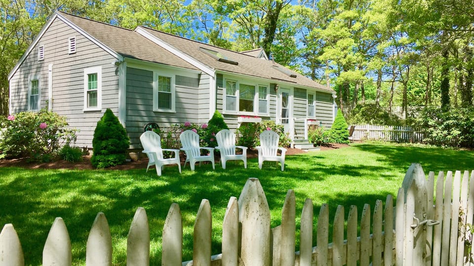 Front of Home with Picket Fence, Yard and Gardens