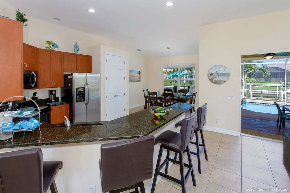 View of Kitchen with Bar and Extra Seating