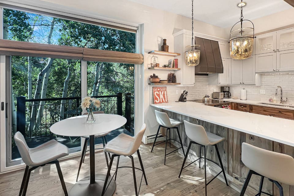 Plenty of seating is found at the dining table and breakfast bar to enjoy dining in during your stay.