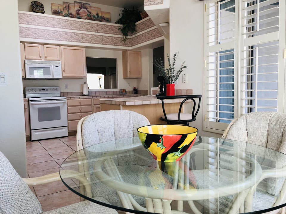 Kitchen dining area, Front patio out right (window) Small work station w/stool