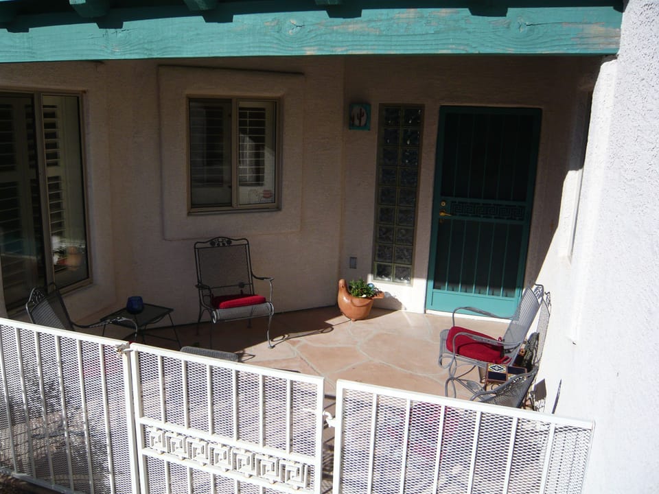 Front patio, middle window is kitchen sink area