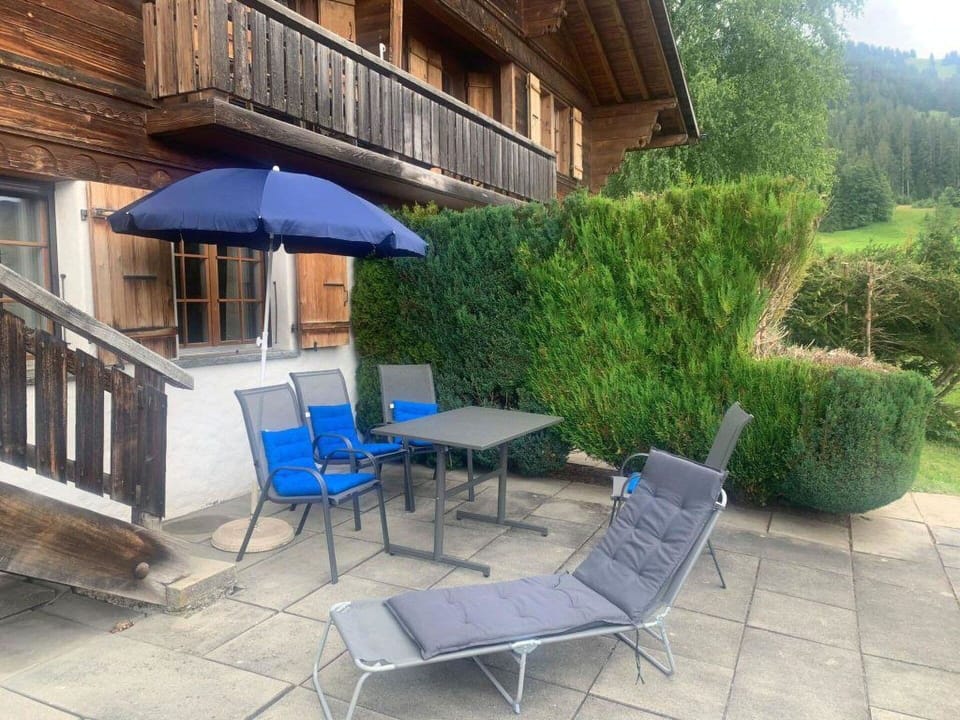 Plant, Property, Building, Furniture, Green, Outdoor Furniture, Umbrella, Tree, Architecture, Chair