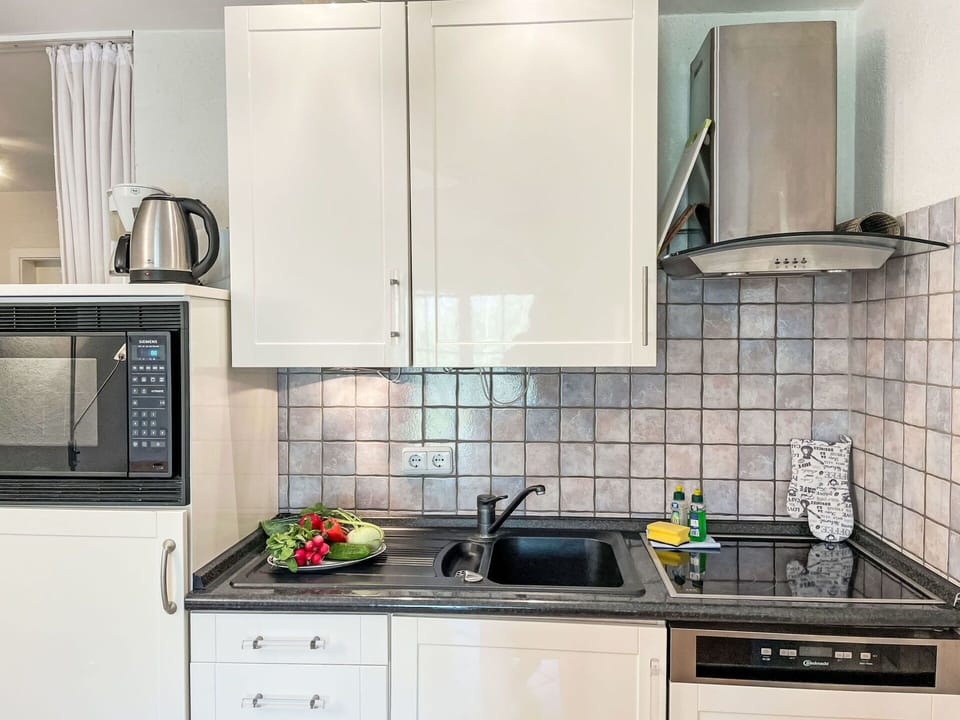 Kitchen Appliance, Kitchen, Countertop, Major Appliance, Cabinetry, Sink, Plumbing Fixture, Home Appliance, Kitchen Sink, Interior Design