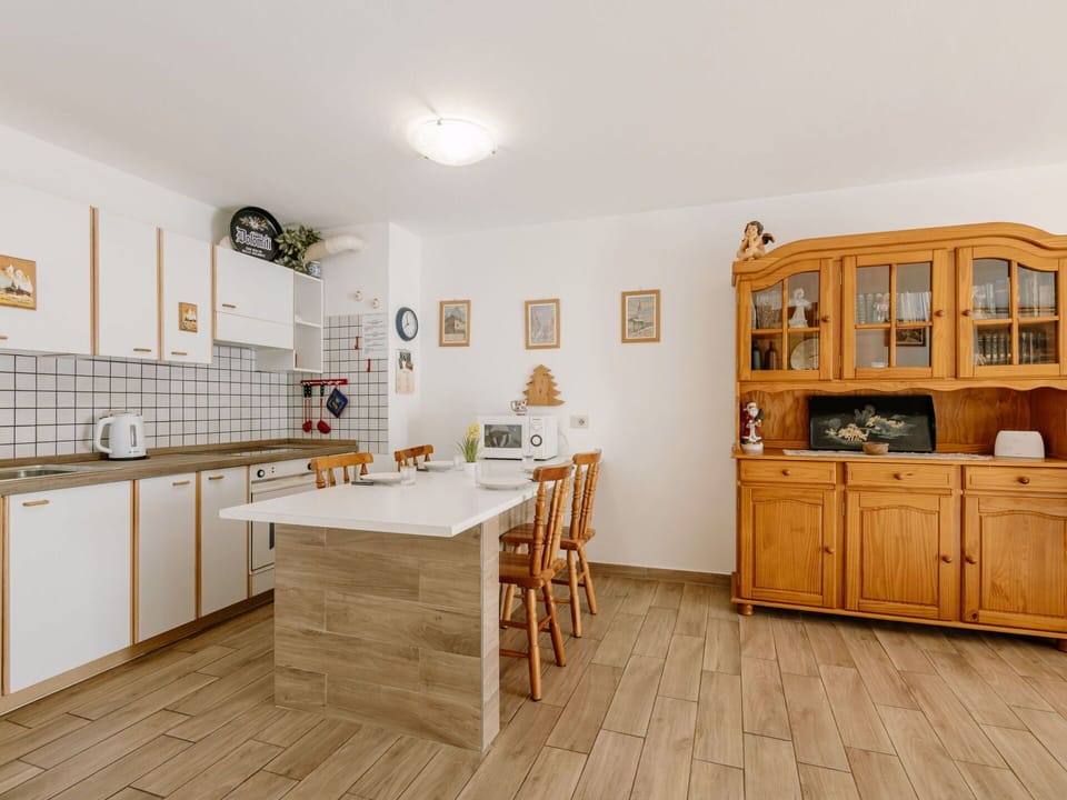 Flooring, Furniture, Floor, Interior Design, Wood, Cabinetry, Kitchen, Wood Flooring, Countertop, Cupboard