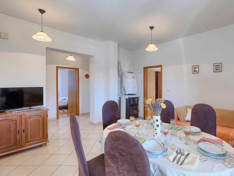 Table, Furniture, Property, Cabinetry, Building, Tableware, Chair, Tablecloth, Lighting, Door